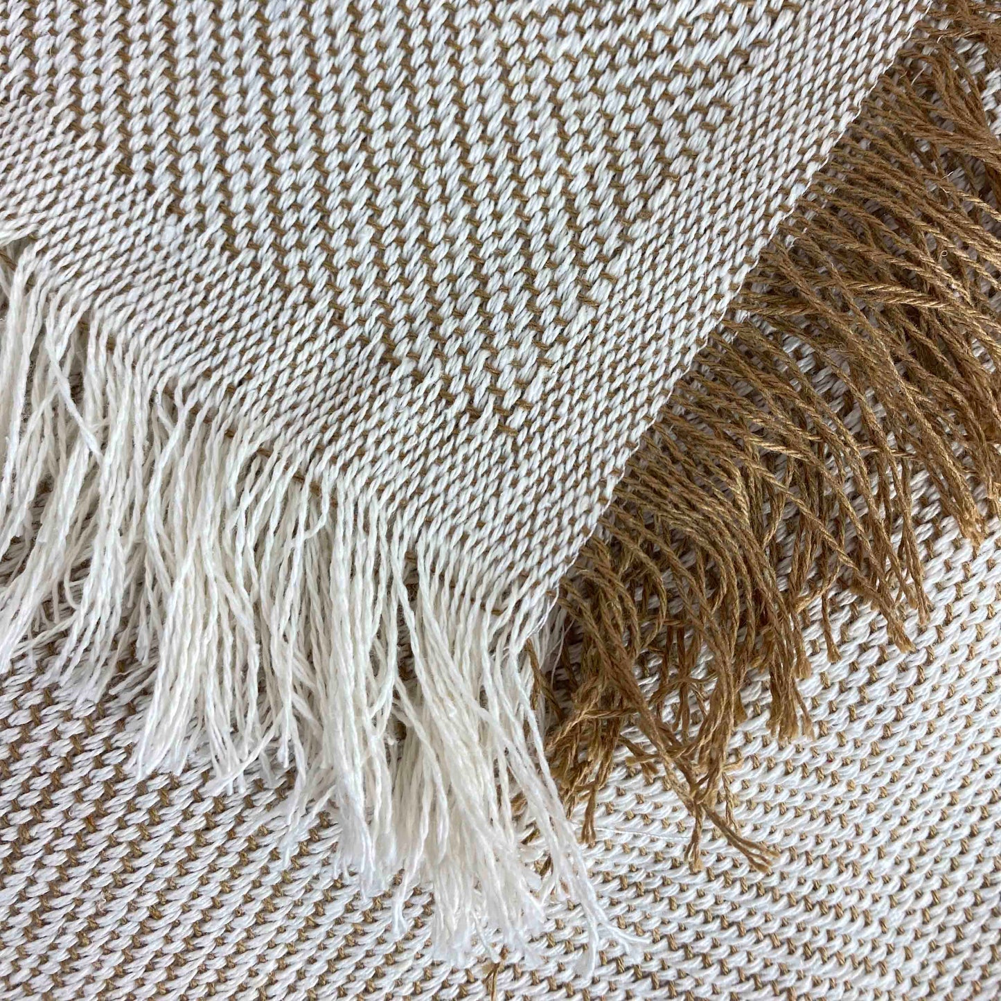 Multipurpose bedspread for sofa or bed with fringes. Beige and Ecru color.