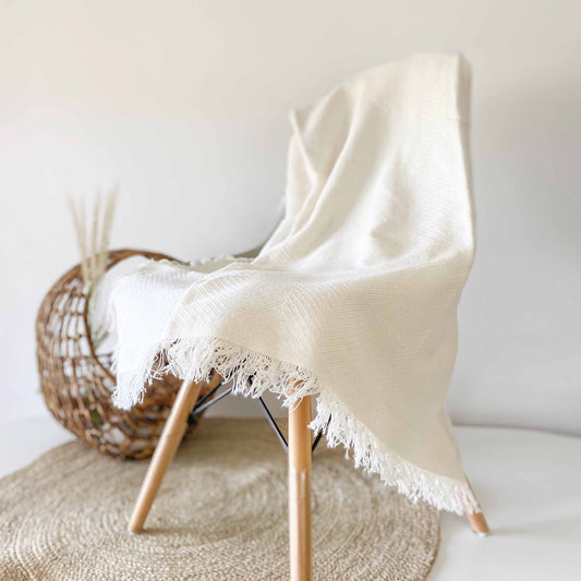 Multipurpose summer quilt for sofa or bed. Off-white color.