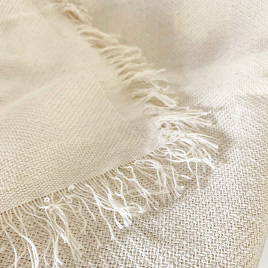 Multipurpose summer quilt for sofa or bed. Off-white color.