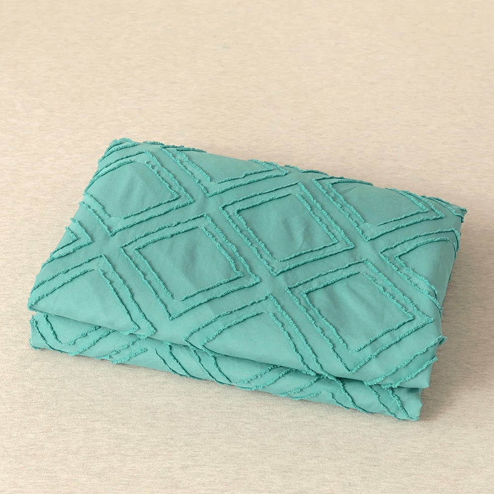 Turquoise duvet cover with embossed rhombuses, modern and extra soft.