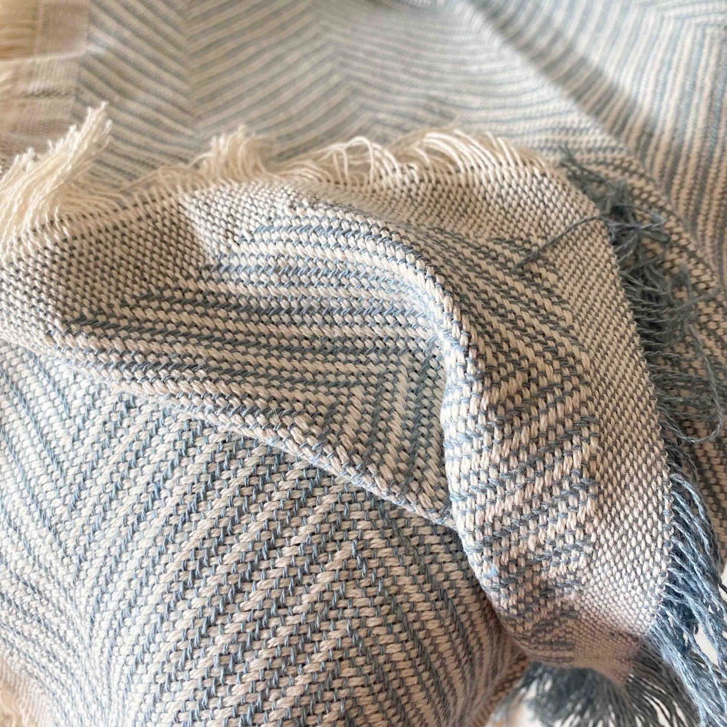Multipurpose bedspread for sofa or bed with fringes. Beige and Ecru color.