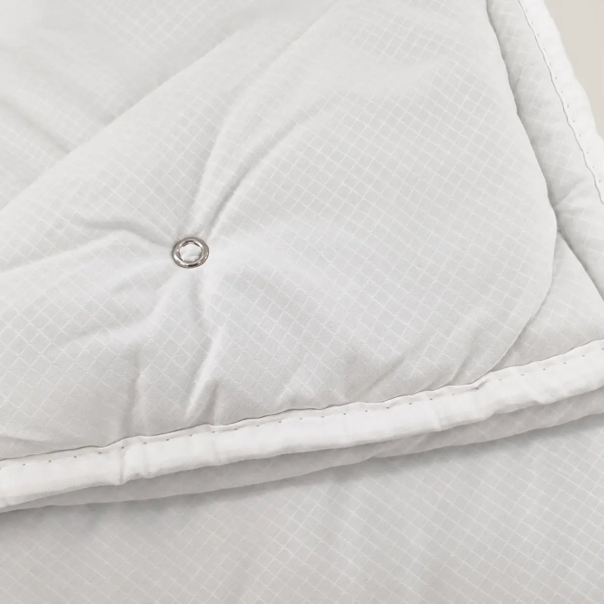 Close-up of the extremely soft, cloud-touch fabric of Oma Home’s mid-season duvet. - Oma Home